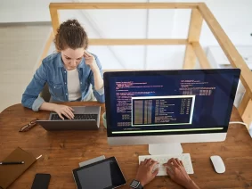 two-young-people-working-in-it-development-studio-2025-03-08-22-50-59-utc